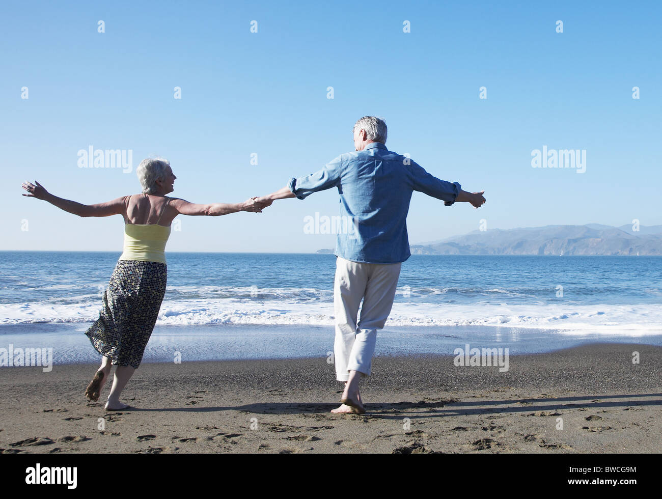 Woman dancing barefoot on sand hi-res stock photography and images - Alamy