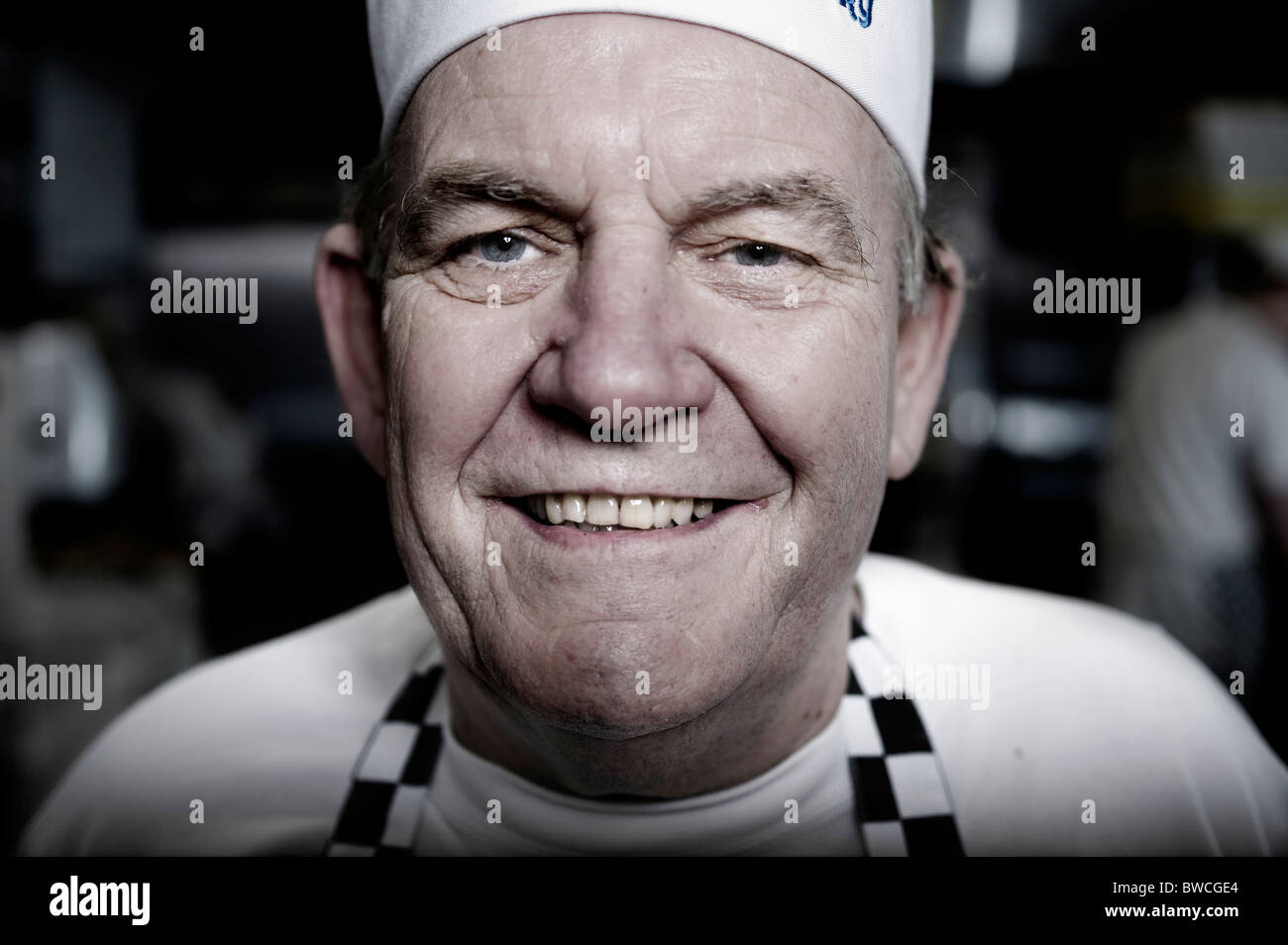 Traditional bakery baker Graham Principe in kitchen, East and West