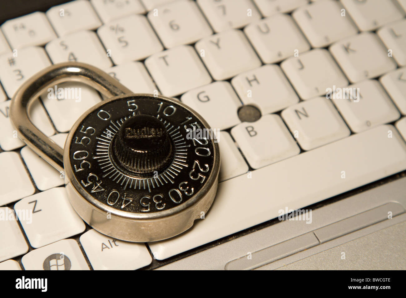 combination lock in front of a computer keyboard Stock Photo Alamy