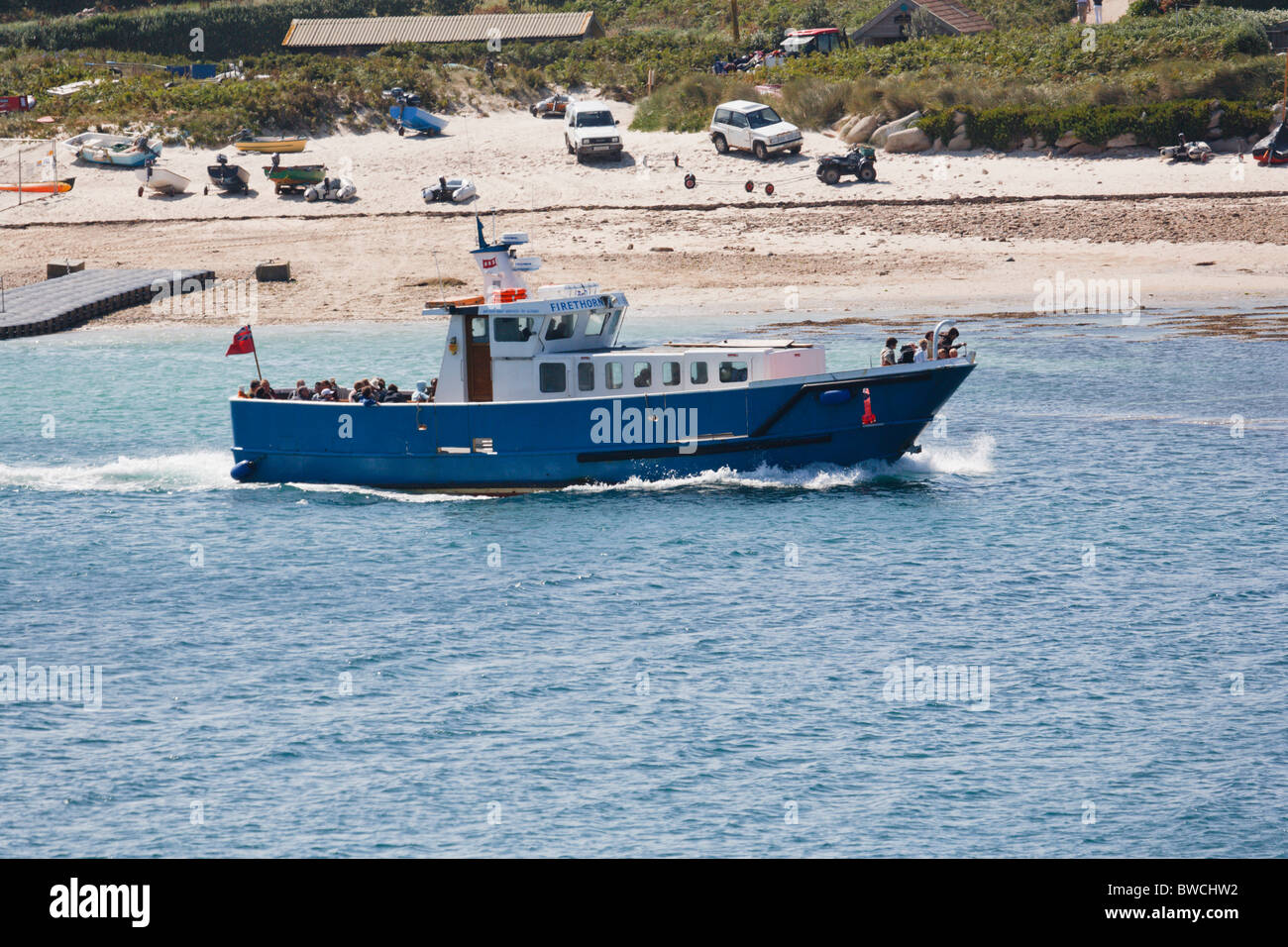 Firethorn off island launch leaving Bryher Stock Photo