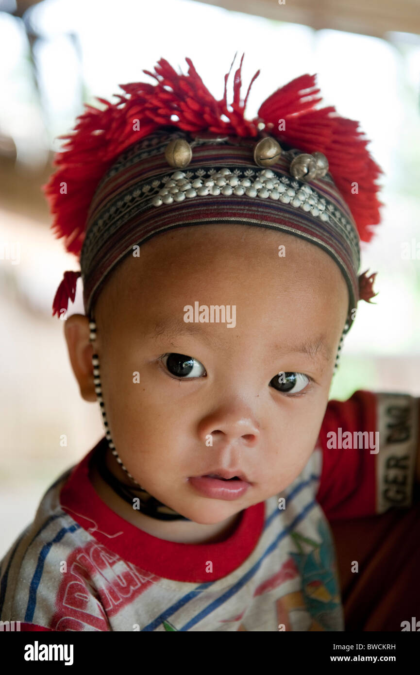 Child from the Red Dao tribe wearing a traditional headdress. North Vietnam Stock Photo