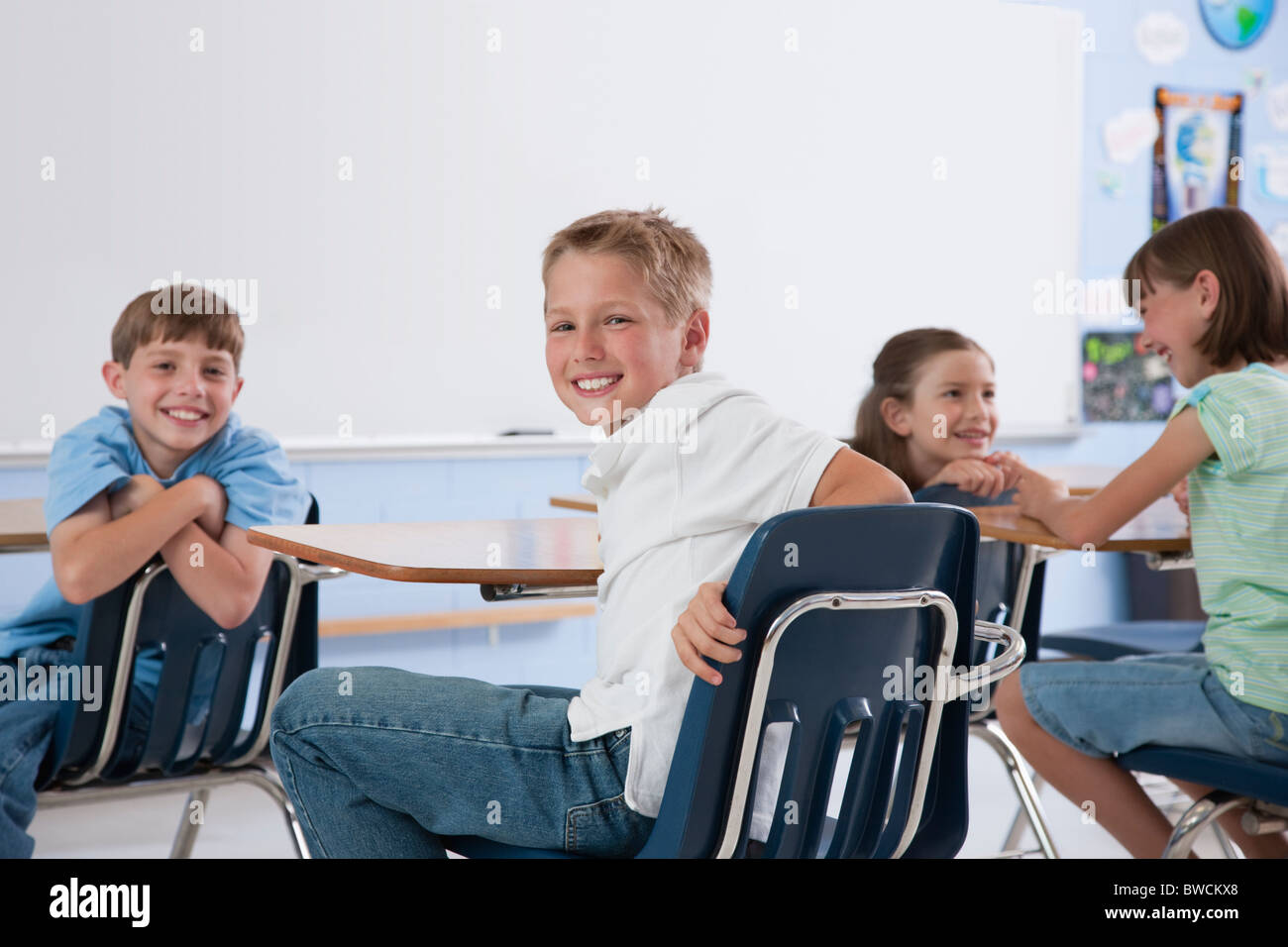 USA, Illinois, Metamora, School children (8-9) smiling in classroom Stock Photo