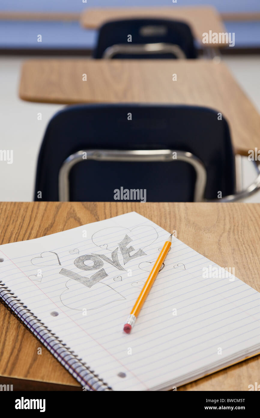 USA, Illinois, Metamora, Pencil and notepad on desk in classroom Stock Photo