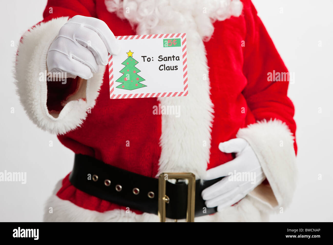 USA, Illinois, Metamora, Midsection of Santa Claus holding letter Stock Photo