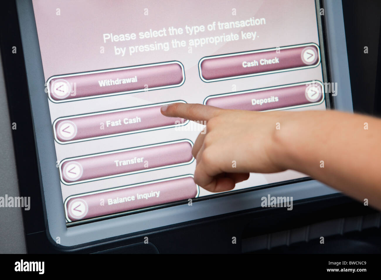 USA, Illinois, Metamora, Person using atm with touch-sensitive display Stock Photo