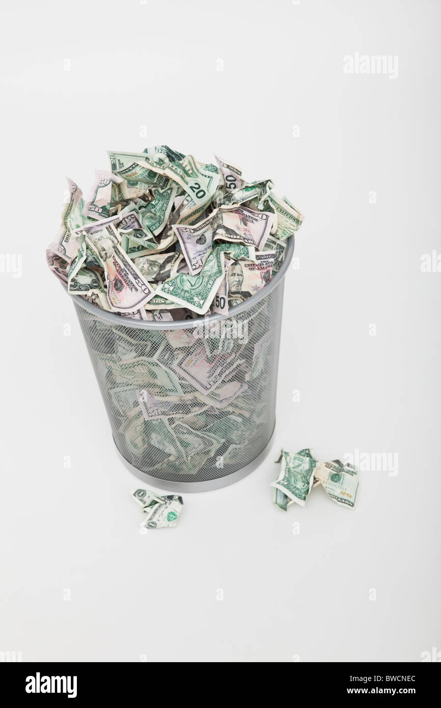 USA, Illinois, Metamora, Pile of money in trashcan Stock Photo