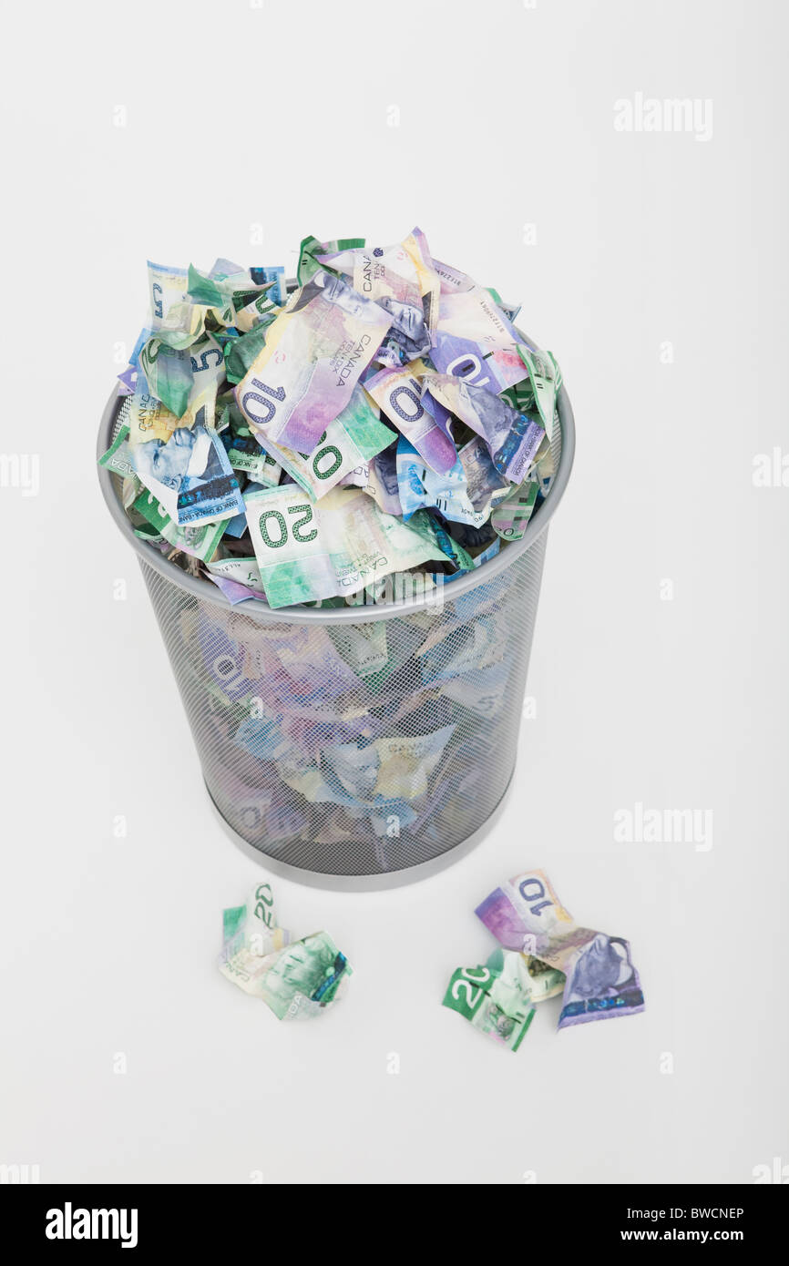 USA, Illinois, Metamora, Pile of money in trashcan Stock Photo