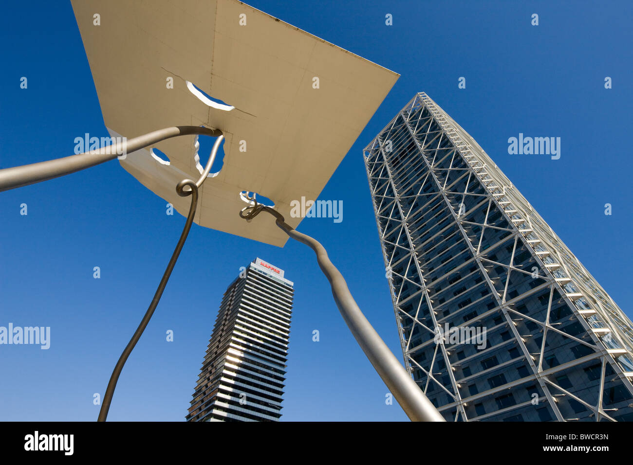 Modern sculpture and the Hotel Arts at the Puerto Olímpico, Olympic port in Barcelona, Spain Stock Photo