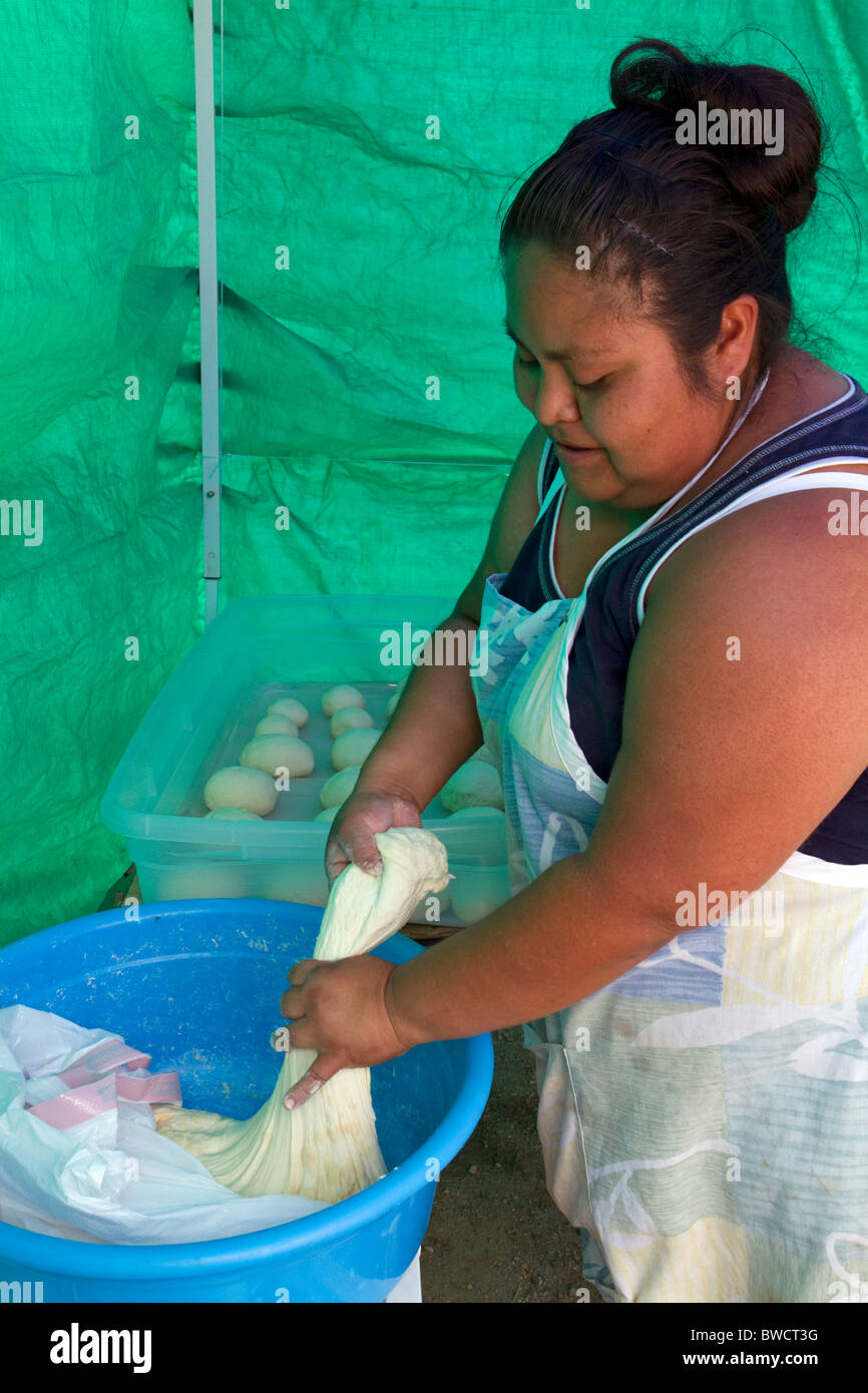 Native Pueblo woman making indian fry bread at Santo Domingo Pueblo