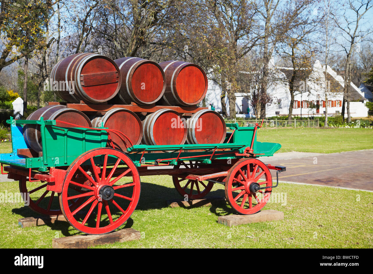 Wine barrels and cart in ground of Blaauwklippen Wine Estate, Stellenbosch, Western Cape, South Africa Stock Photo