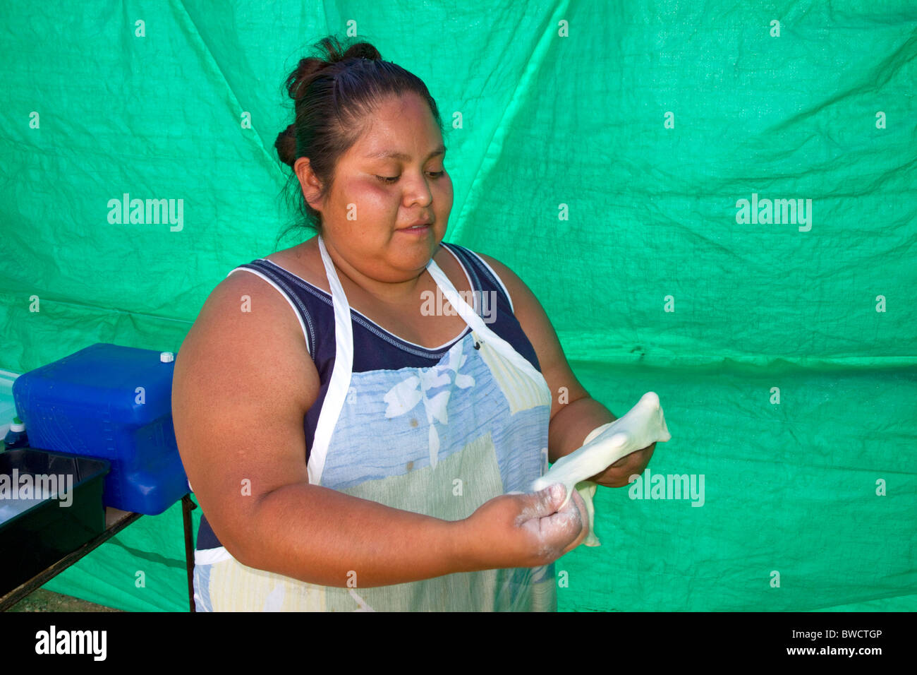 Native Pueblo woman making indian fry bread at Santo Domingo Pueblo
