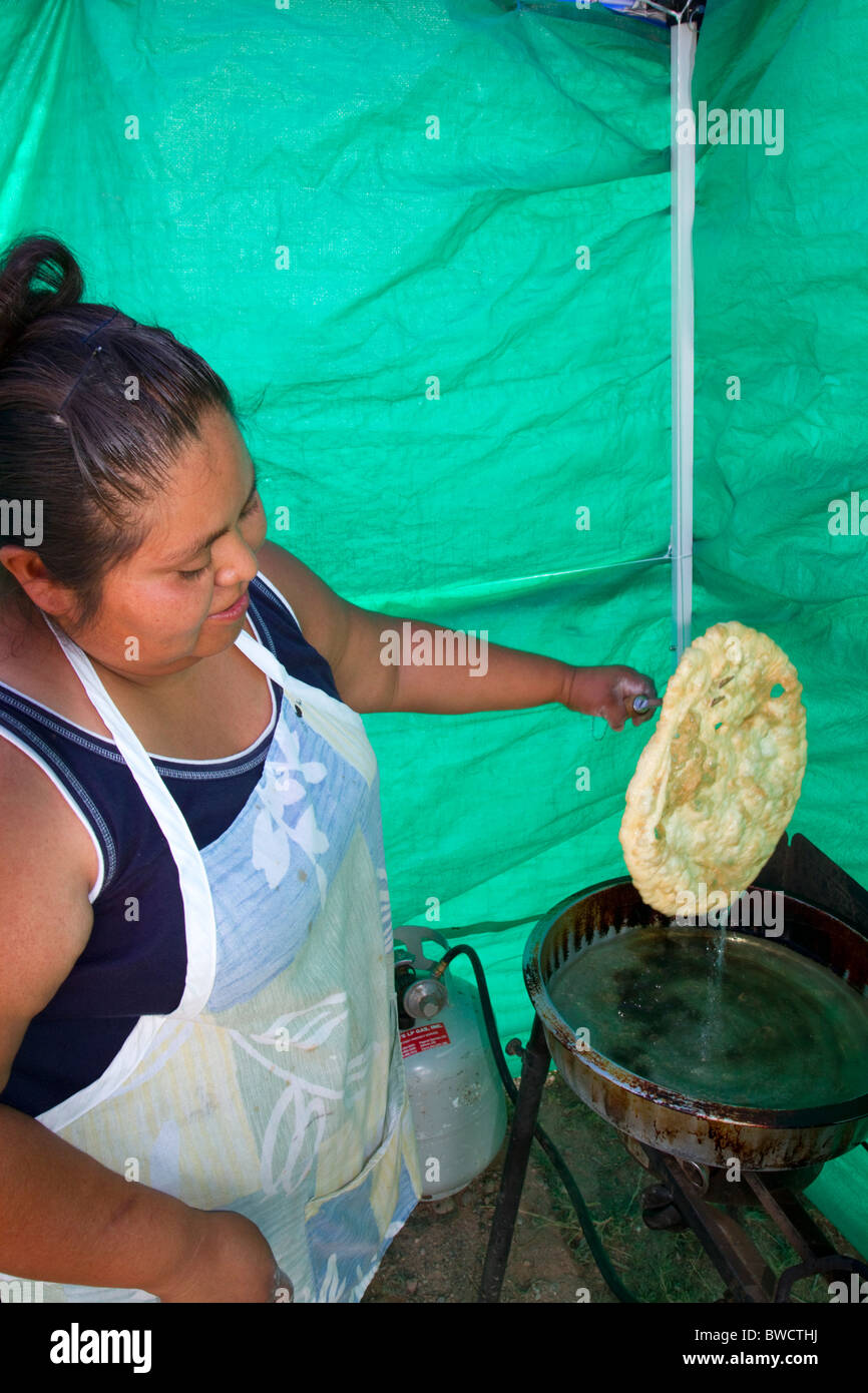 Native Pueblo woman making indian fry bread at Santo Domingo Pueblo, New Mexico, USA. MR Stock Photo