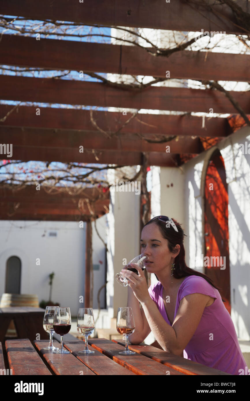 Woman tasting wine at Blaauwklippen Wine Estate, Stellenbosch, Western Cape, South Africa Stock Photo