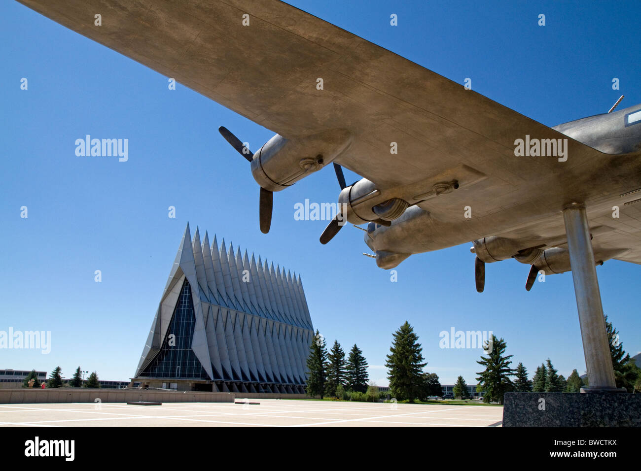 Bronze sculpture of vintage WW11 aircraft in front of the Cadet Chapel at the Air Force Academy, Colorado Springs, Colorado, USA Stock Photo