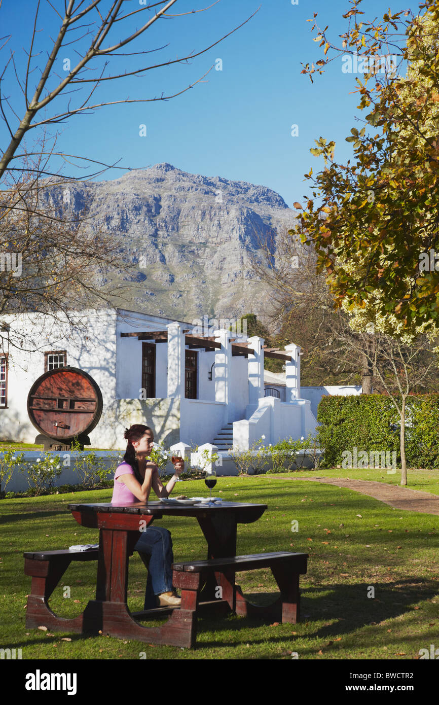 Woman with cheese platter and wine at Blaauwklippen Wine Estate, Stellenbosch, Western Cape, South Africa (MR) Stock Photo