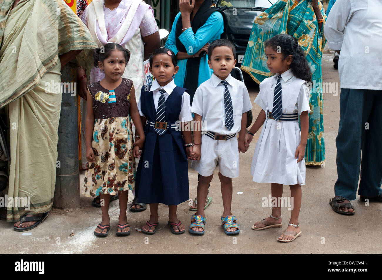 Indian school children in a crowd on the street of Puttaparthi, Andhra Pradesh, India Stock Photo