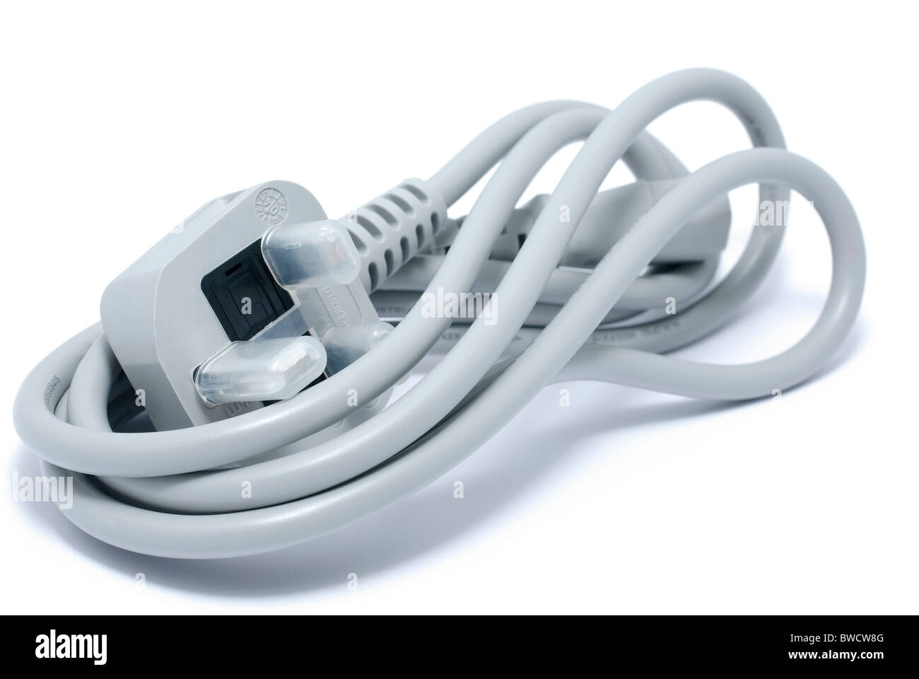 Unused gray power cable for computer. Isolated on white background with shadow. Stock Photo