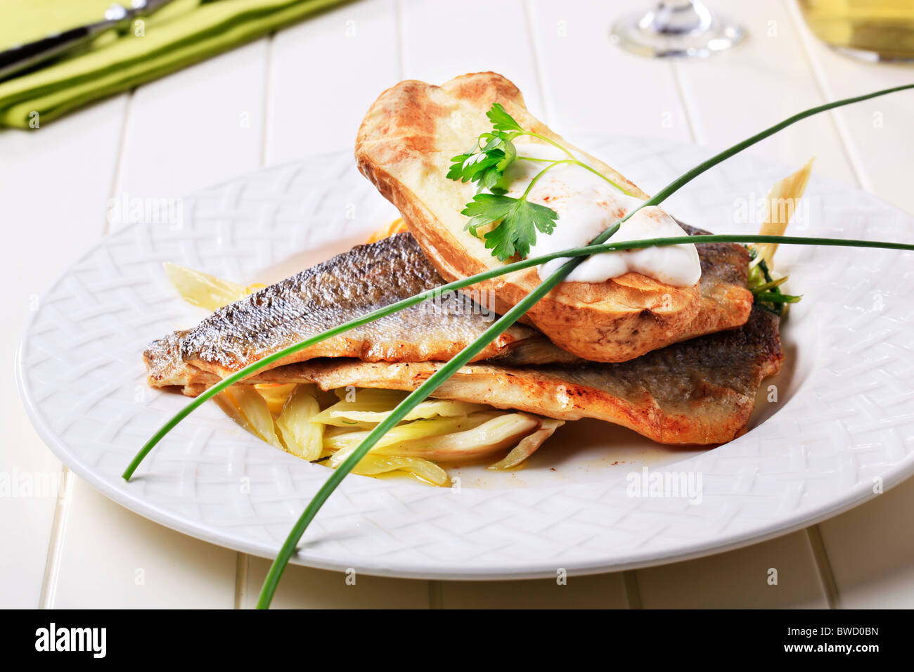 Pan fried trout fillets and baked potato - closeup Stock Photo