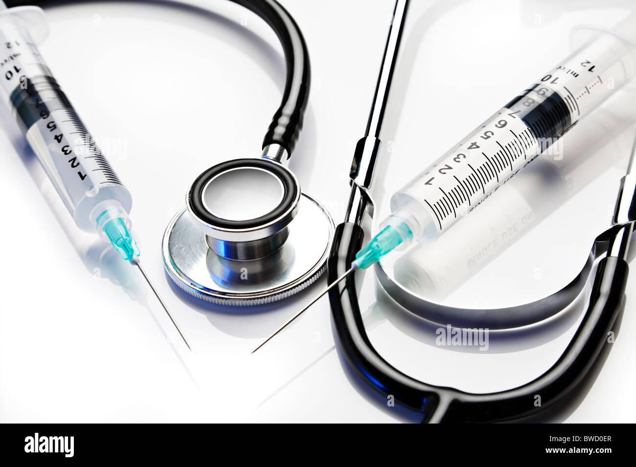 Stethoscope and syringes on white Stock Photo - Alamy