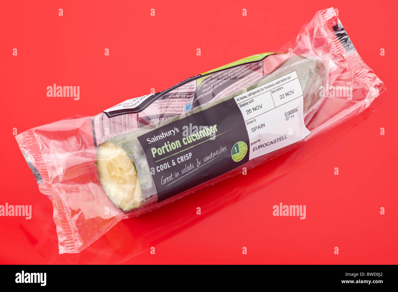 Sainsbury's cellophane wrapped portion of cucumber imported Spain Eurocastell Stock Photo
