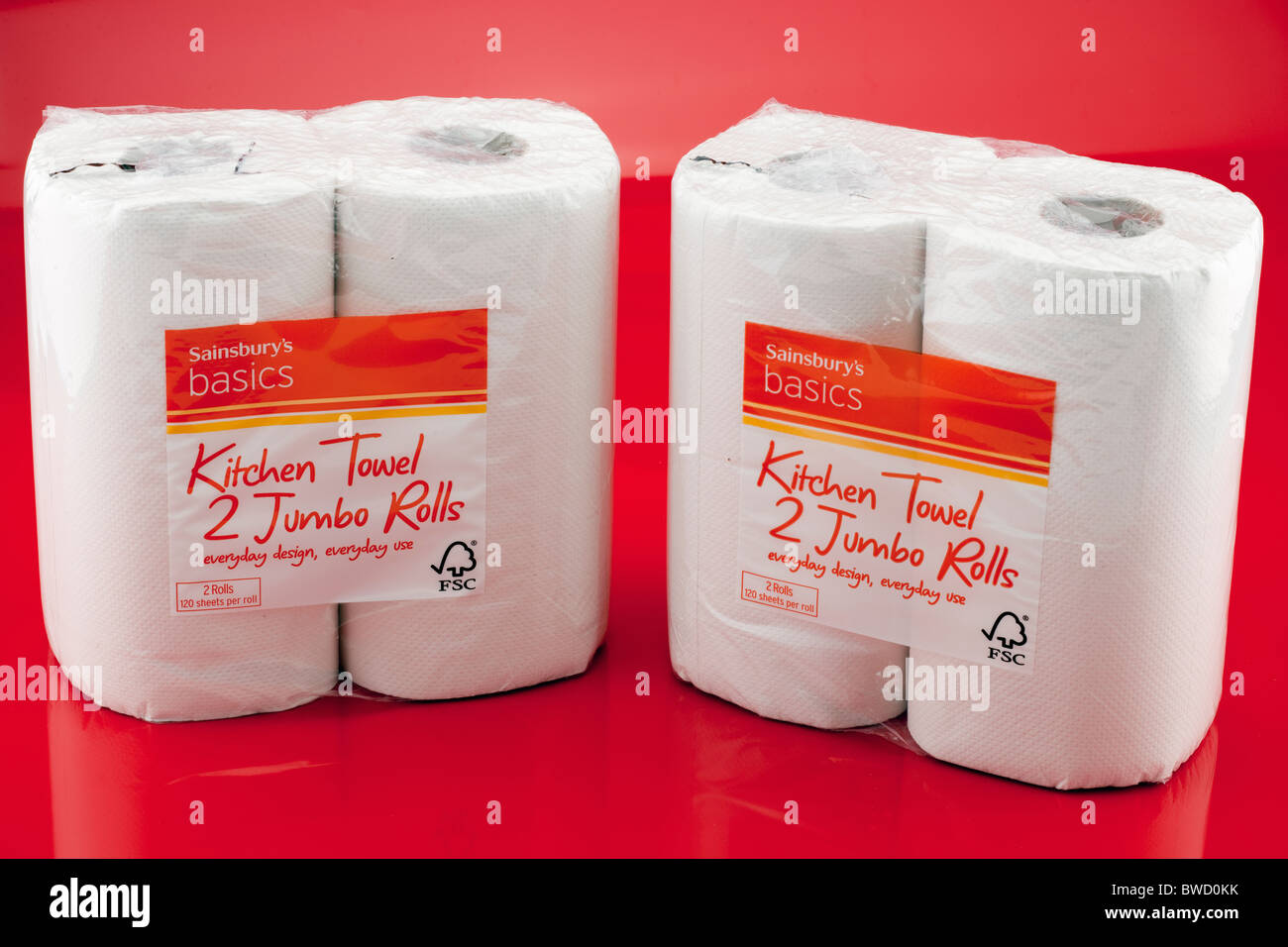 Two two packs of Sainsburys basics white paper kitchen jumbo rolls Stock Photo