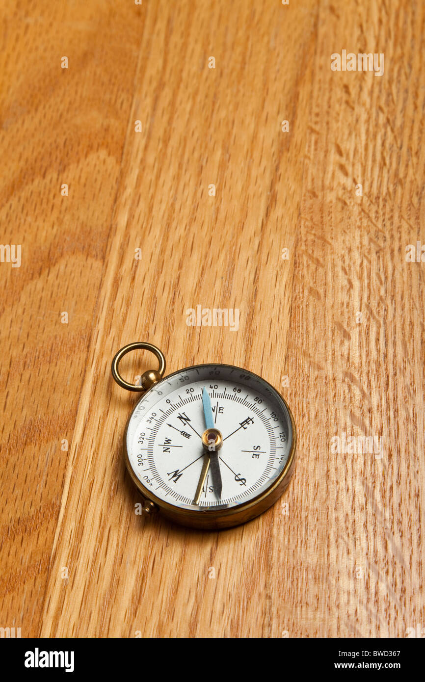 Old Compass on wood tabletop Stock Photo - Alamy