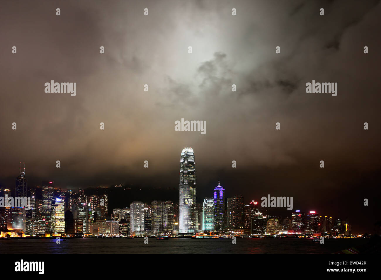 Hong Kong Island skyline at night viewed from the Kowloon mainland Stock Photo