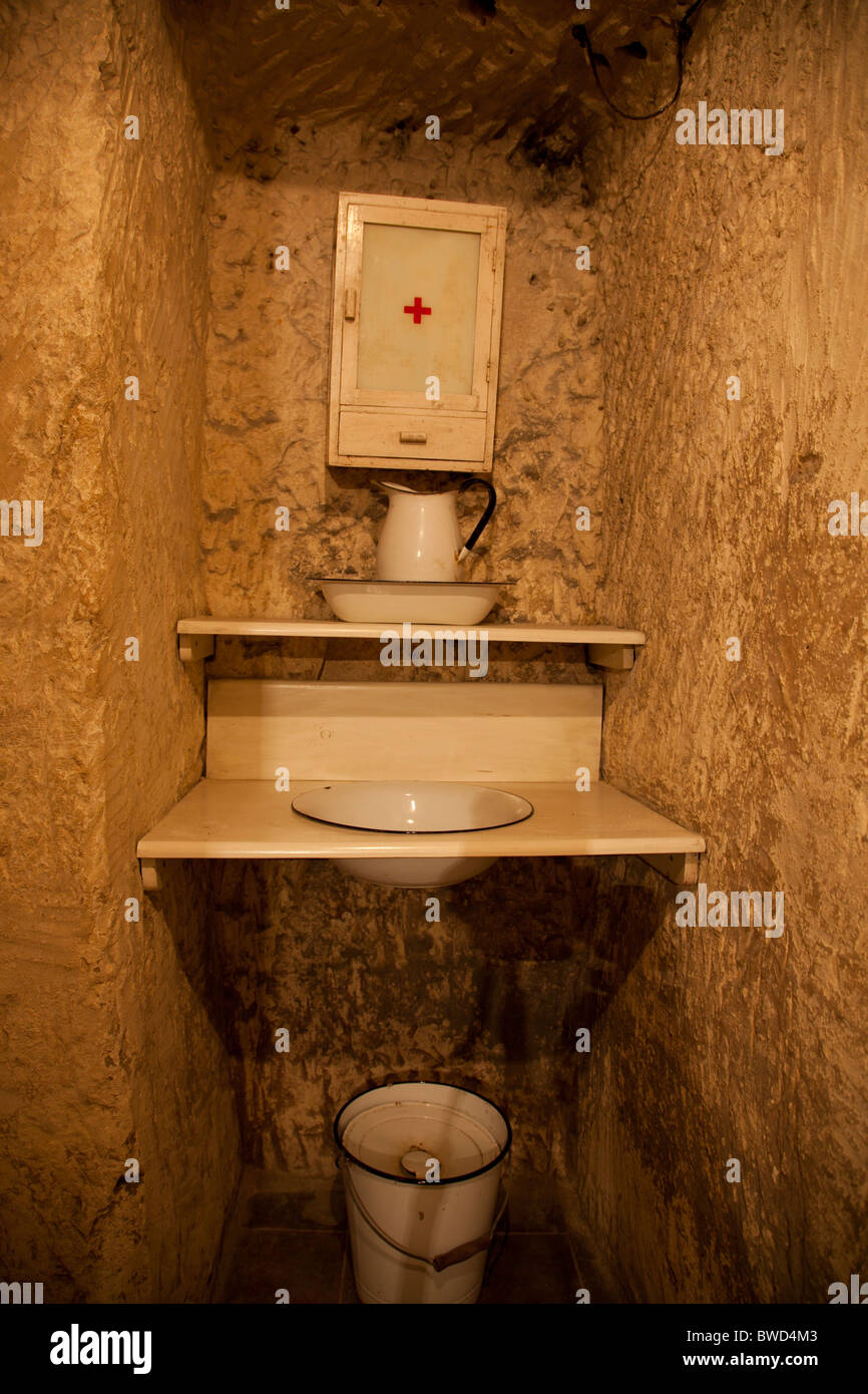 A private cubicle with period furniture in a former underground bomb shelter now opened as a historic attraction in Malta. Stock Photo