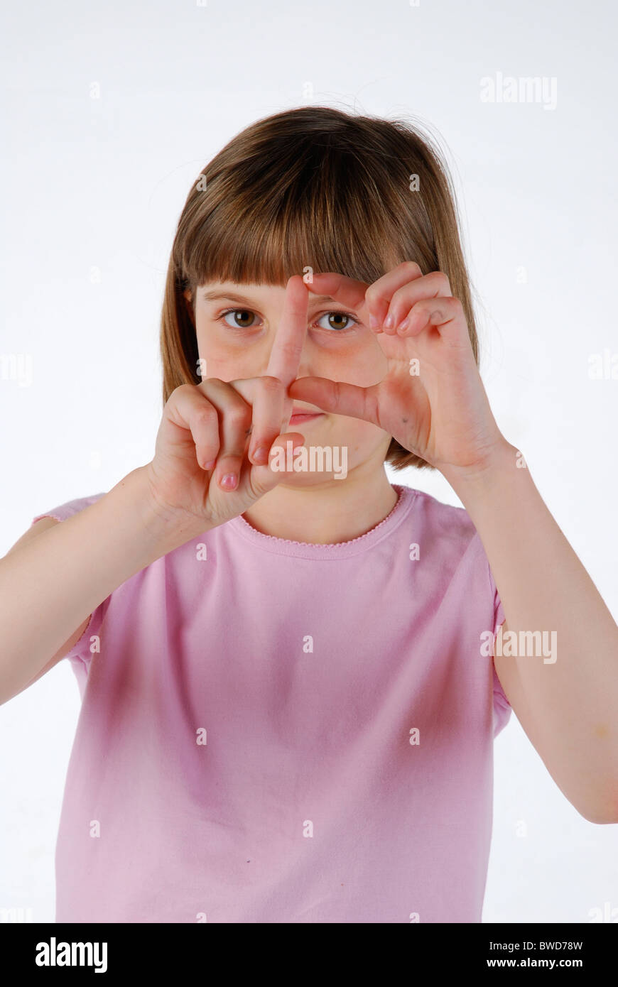 Young girl signing the D sign language for the deaf Stock Photo