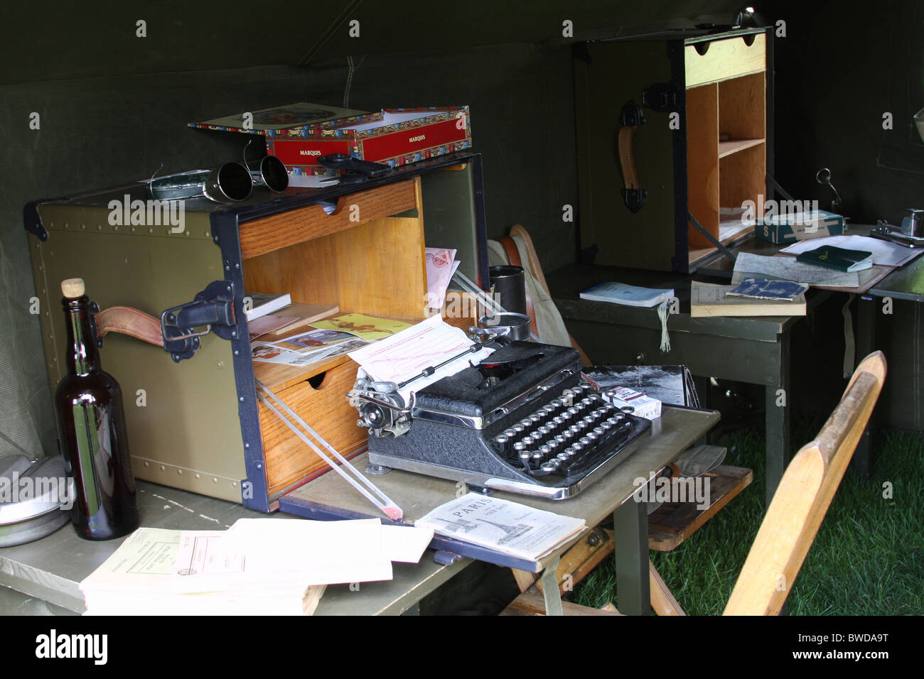 A World War II clerk desk and a manual type writer in a tent camp Stock Photo