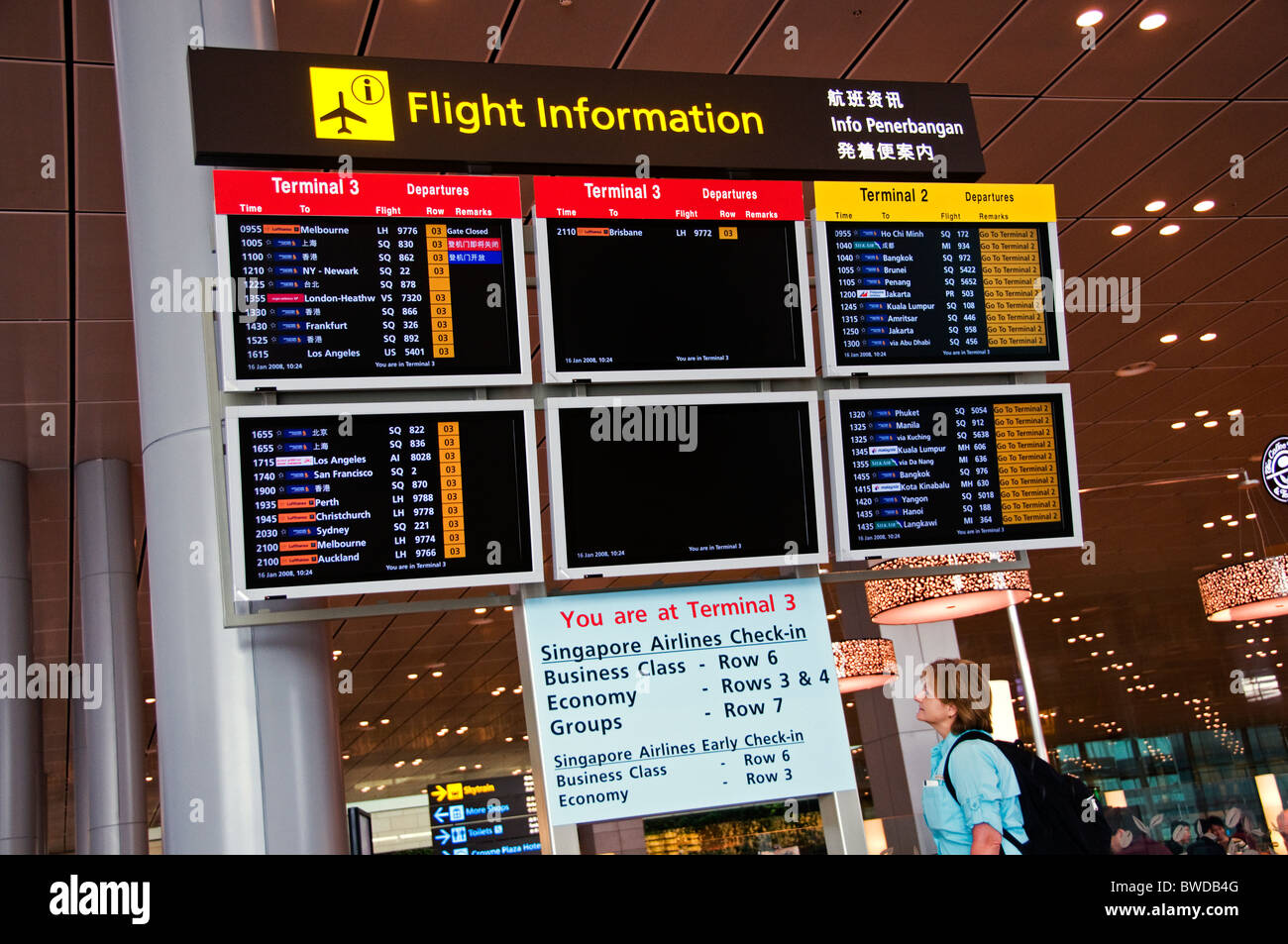 CRT monitors for departure and arrival times at new modern airport in Singapore southeast Asia Stock Photo