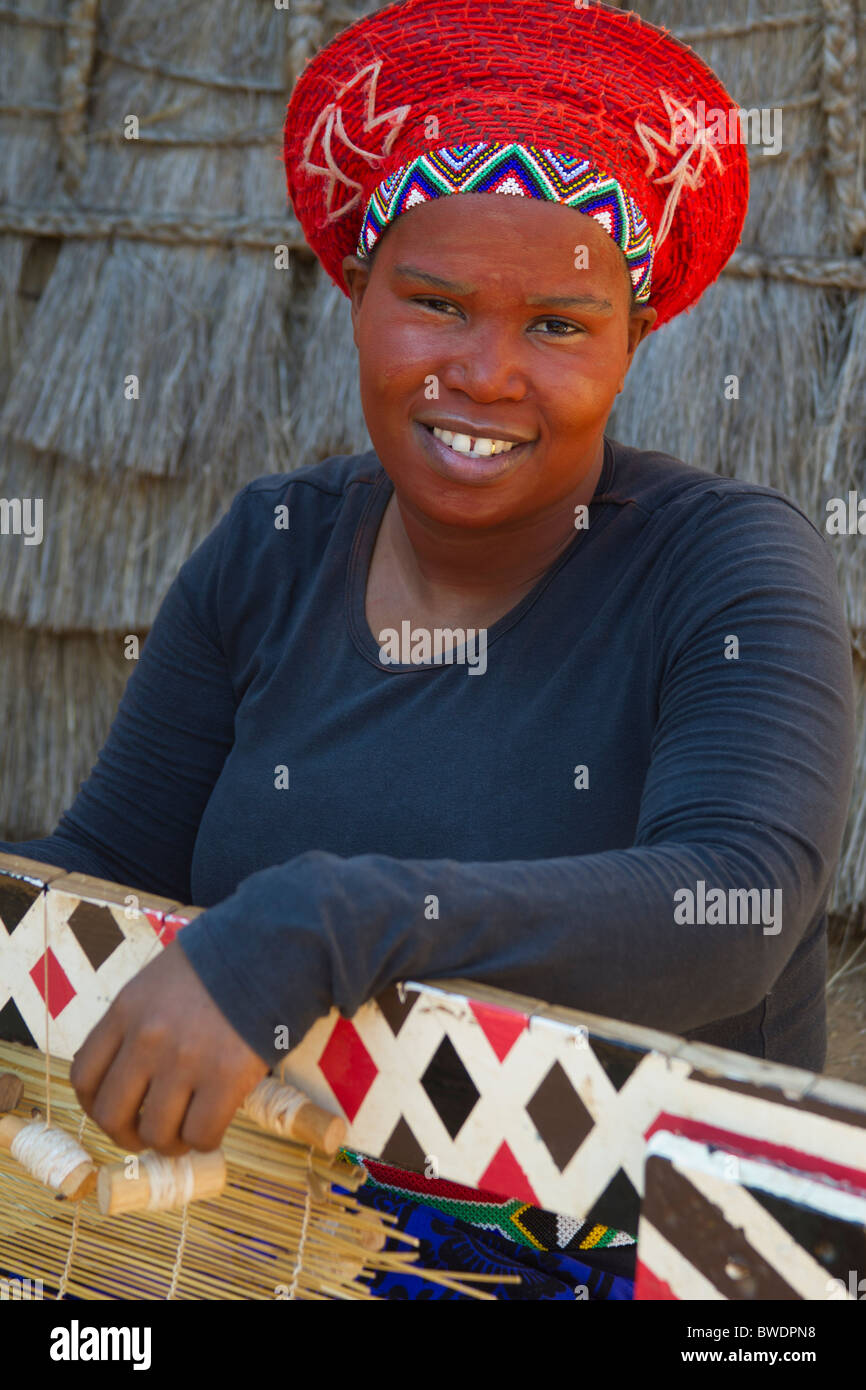 Zulu Woman Weaving a Rush Mat, Shakaland, South Africa Stock Photo