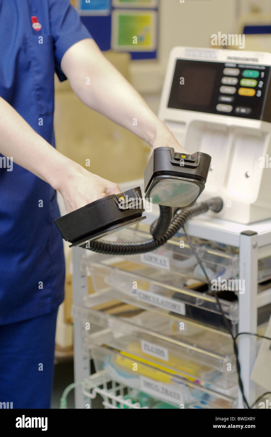 Medical staff using a defibrillator in a training ward in a hospital