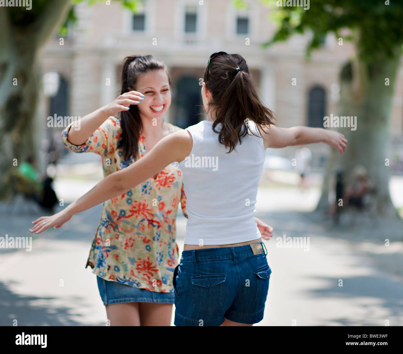 Happy young woman hugging hi-res stock photography and images - Alamy