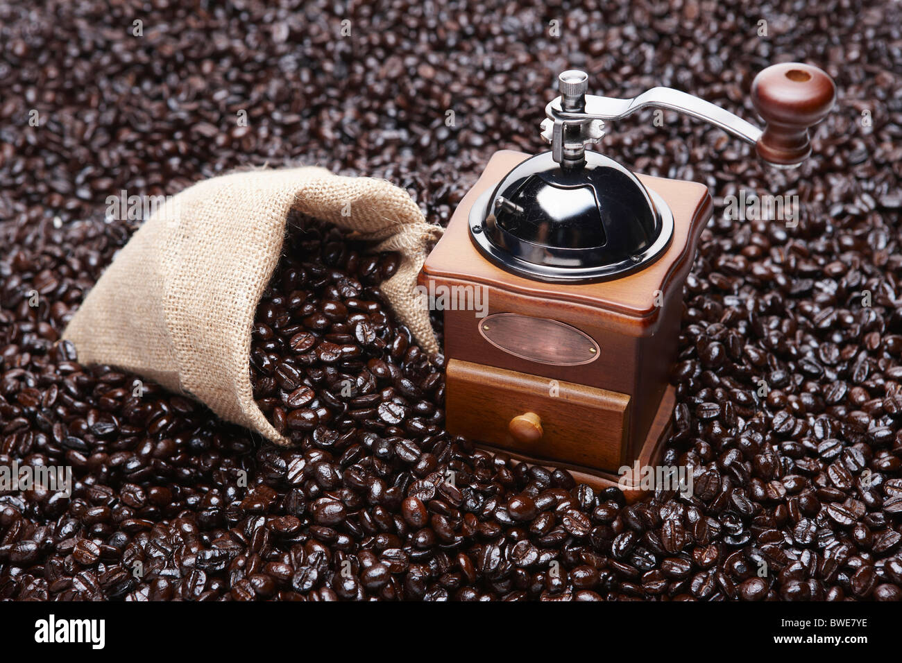 roasted coffee beans and grinder Stock Photo - Alamy