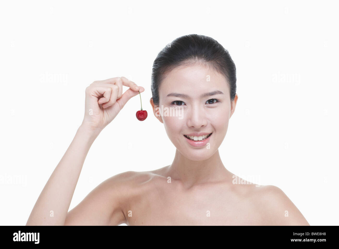 cherry and spotless skin woman Stock Photo Alamy