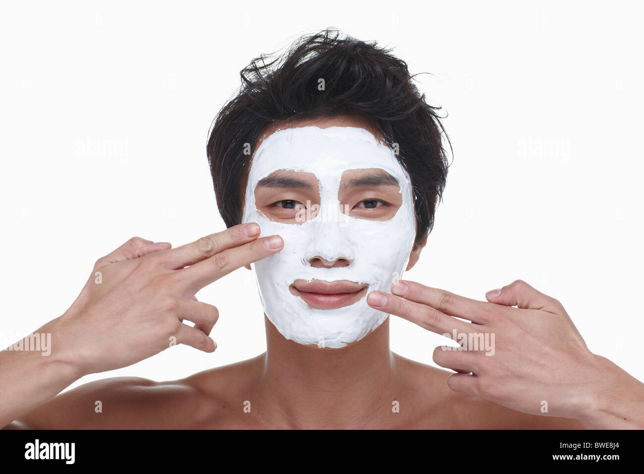 guy is doing a face pack Stock Photo