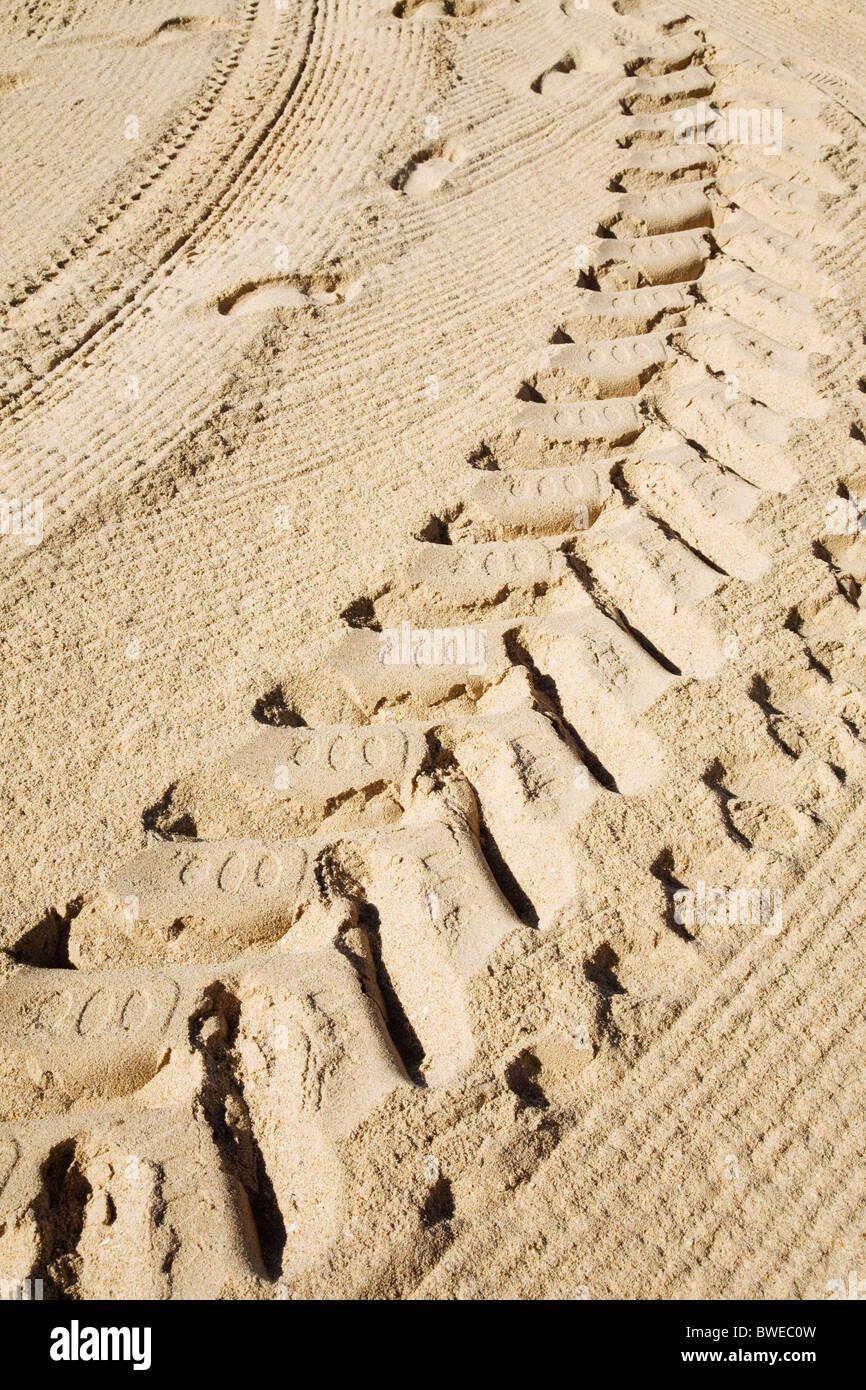 Tyre tracks in the sand. Stock Photo