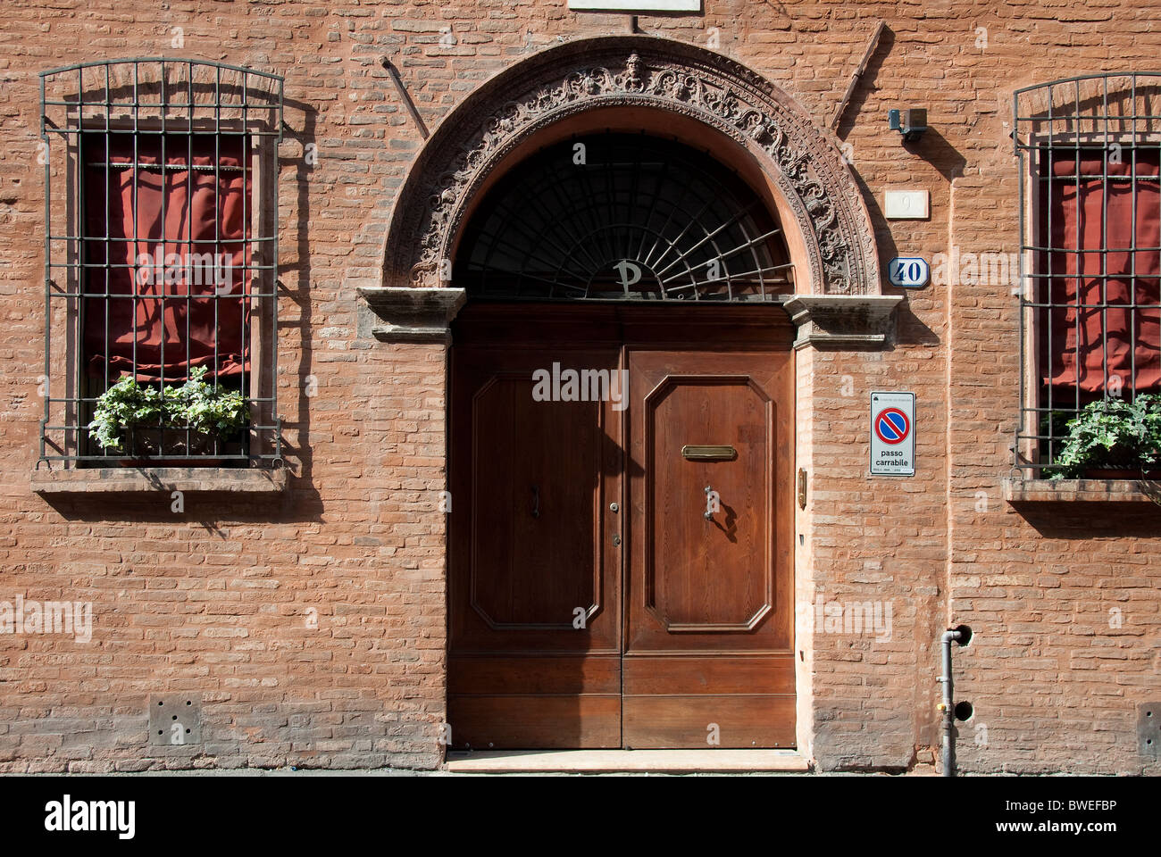 Door of a typical palazzo in Ferrara, Italy Stock Photo
