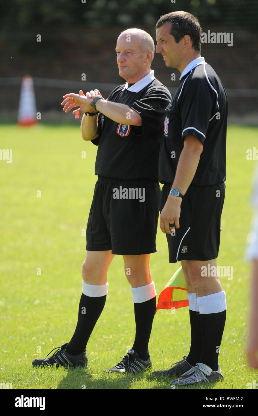 Referees in action during a football match Stock Photo Alamy