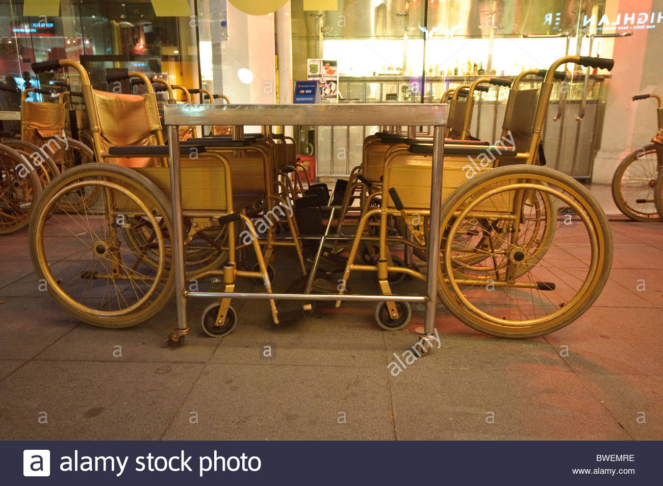 Wheelchairs And Hospital Table Used As Furniture In A Bar Hip