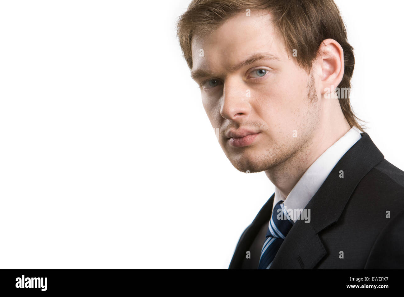 Smart serious businessman looking at camera on white background Stock ...