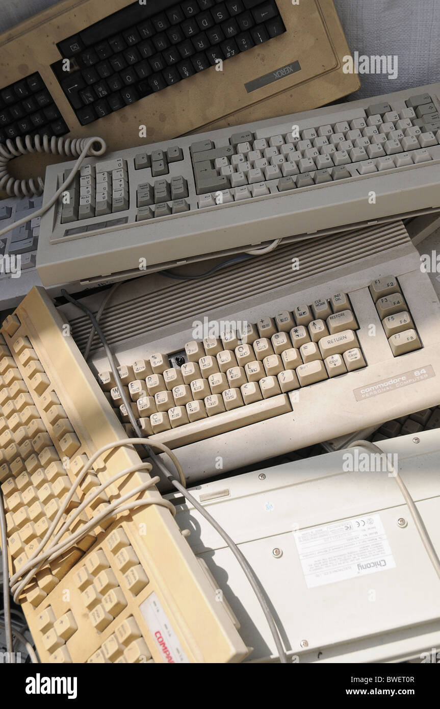 A pile of old unused keyboards at a bring in site for waste separation. Stock Photo