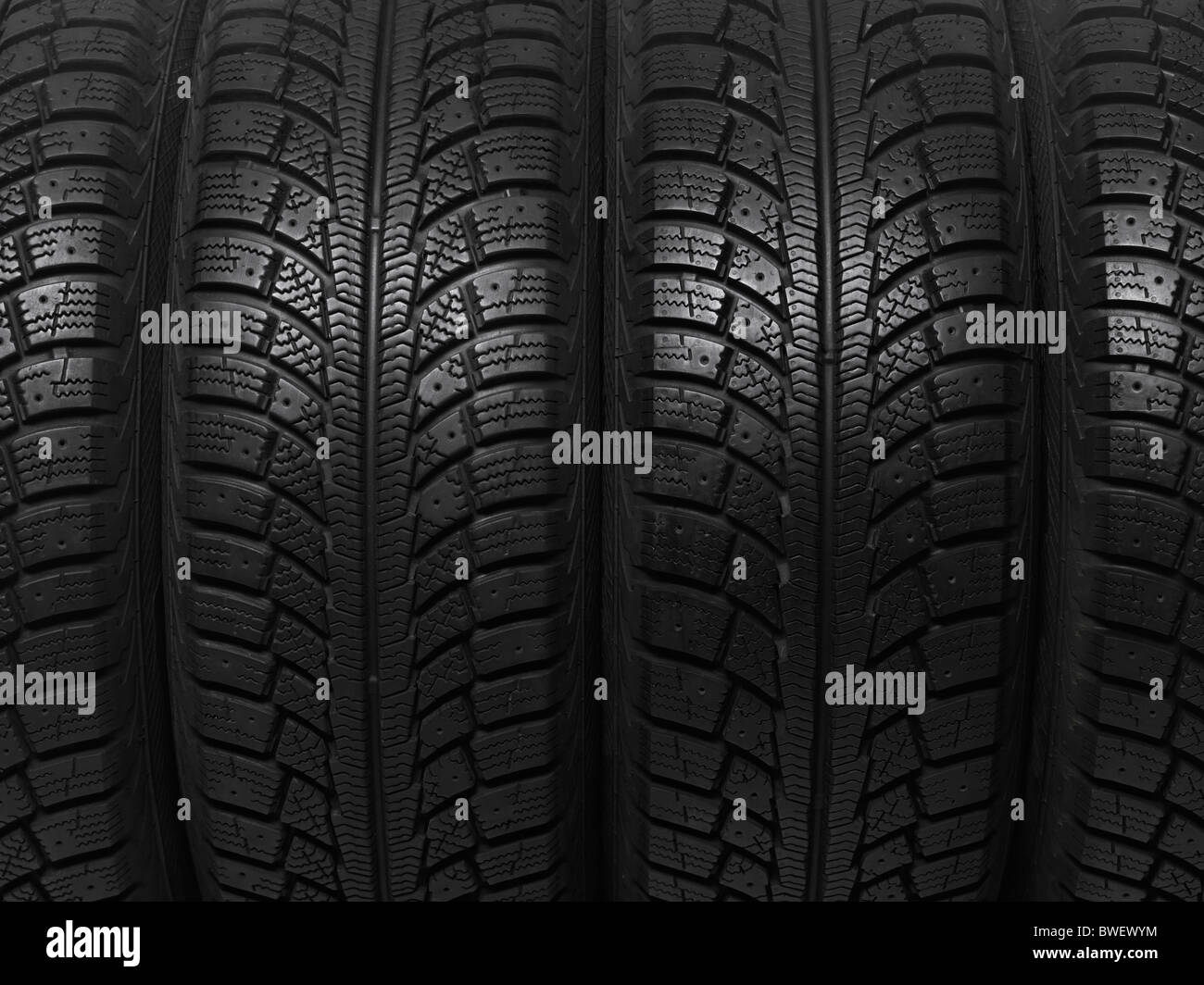 Closeup of a winter car tires background texture Stock Photo