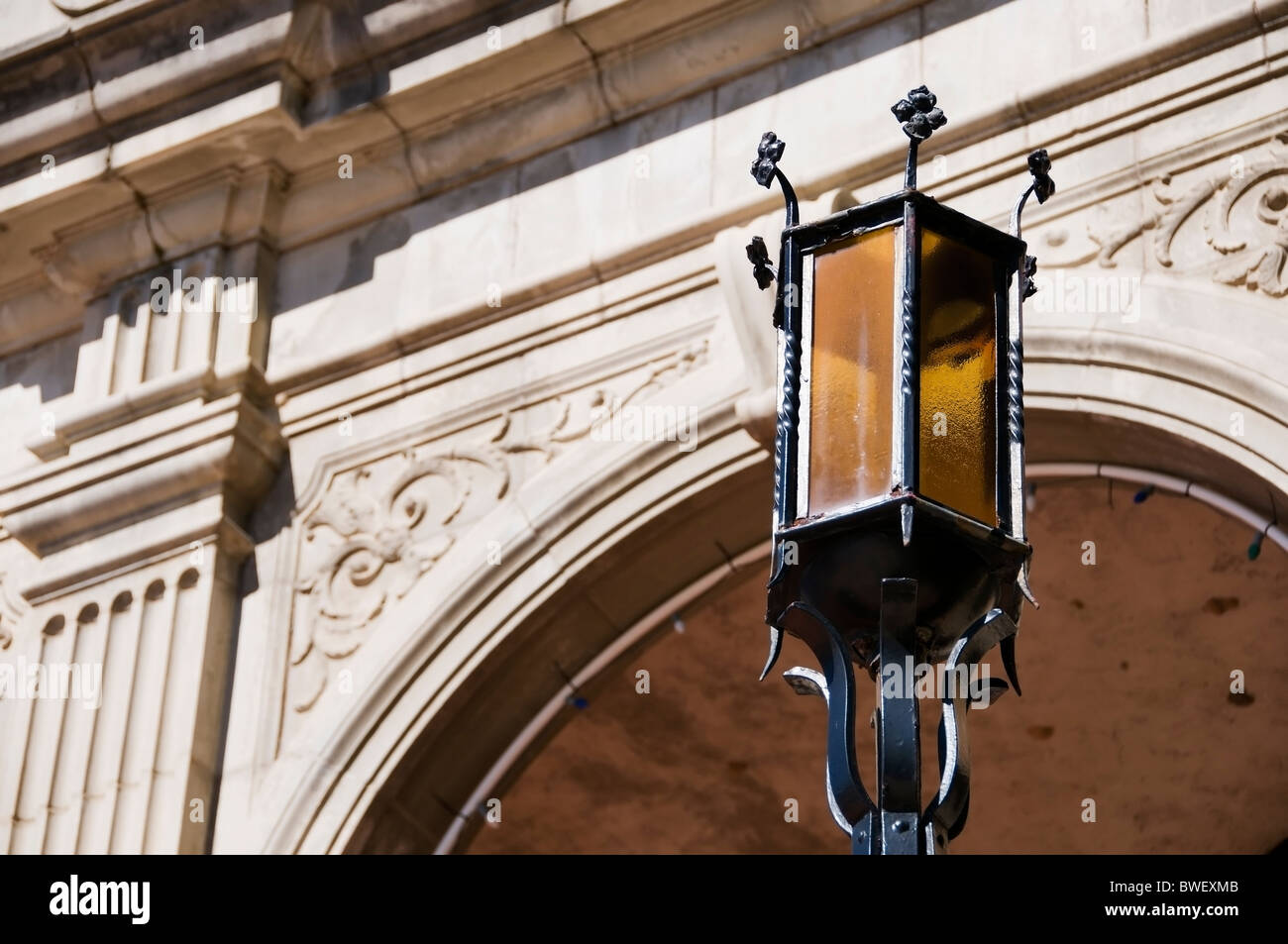 Antique exterior light fixture in front of a beautiful section of the Baker Hotel in Mineral Wells, Texas. Stock Photo