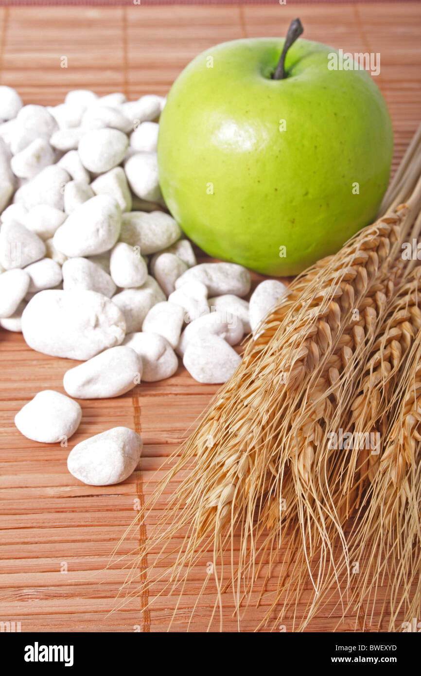 Apple andsomegrain symbolizing thanksgiving or a good harvest Stock Photo