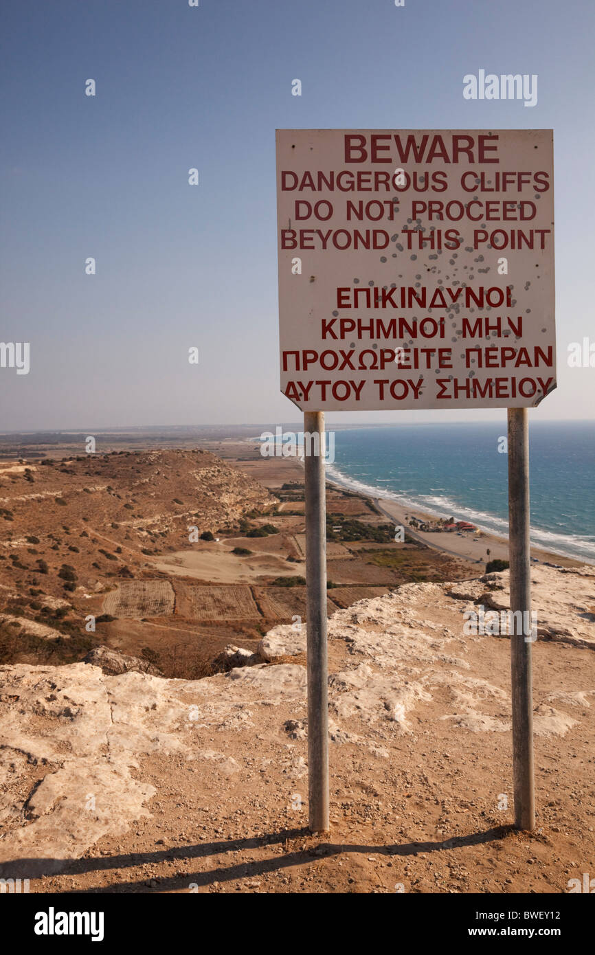 Warning sign for dangerous cliffs, Kourion, Cyprus Stock Photo