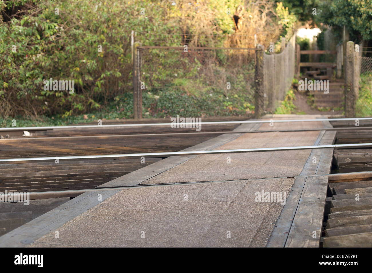 Unmanned pedestrian railway crossing footpath warning signs South eastern Trains Stock Photo