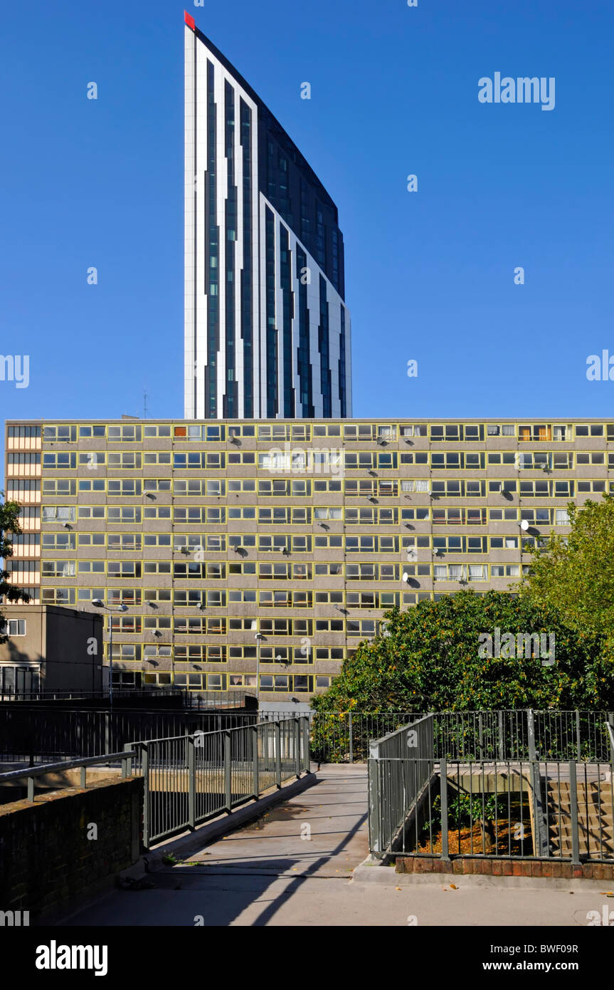 New Strata residential apartment tower block rising above old run-down Heygate council housing Estate at Elephant & Castle Stock Photo