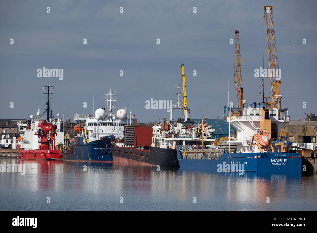 General cargo and oil support vessels alongside Montrose Harbour Stock Photo